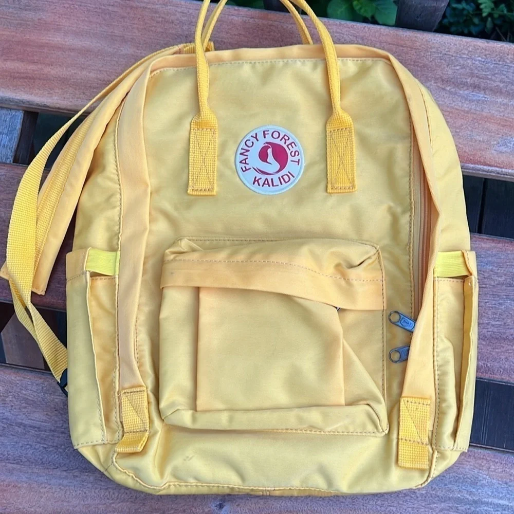 Fancy Forest Kalidi backpack yellow like new !